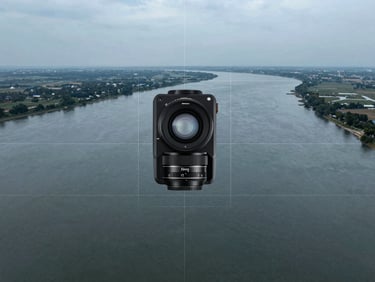 Crisp technical photography of a wide environmental landscape of a river delta with clean vector grid lines, cool overcast tones, digital telemetry overlay, 35mm lens.