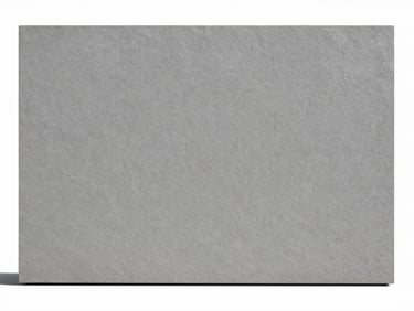 Straight-on architectural elevation of a massive grey vitrified slab, matte texture, minimalist setting, bright neutral daylight, clean white and charcoal tones, sharp focus, 35mm lens