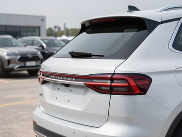 Clean silver family SUV, close-up of rear lights and trunk, organized auction yard in background, bright daylight, professional studio lighting, 50mm