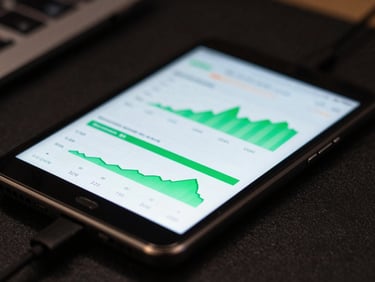Close-up of a developer workspace with a physical Android device displaying real-time data synchronization charts, low-key ambient lighting, sharp screen glow