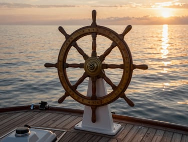 Boat helm and deck overlooking calm coastal water at golden hour, warm reflections on the water surface