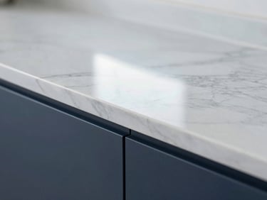 Macro architectural shot of a clean marble countertop reflecting bright, clinical natural light, sharp focus, 35mm
