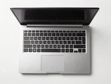 Overhead straight-on product shot of an Acer refurbished laptop open on a white surface, clean studio lighting, no reflections