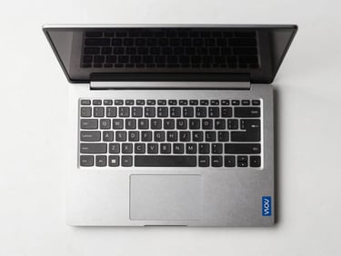 Overhead straight-on product shot of a Lenovo refurbished laptop open on a white surface, clean studio lighting, no reflections