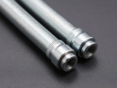 Close-up of dual-ended steel link stabilizers with polyurethane bushings, high-contrast studio lighting highlighting the metallic surface
