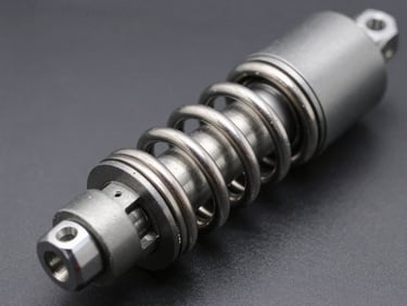 Macro shot of a high-performance shock breaker cylinder, metallic gray finish, sharp industrial lighting reflecting off the steel spring