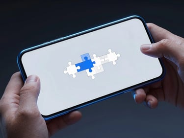 Close-up of hands holding an Android device playing a minimalist puzzle game, cool silver and blue neon highlights, sharp details