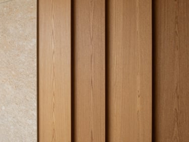 Close-up of premium warm oak wood panels, fine grain texture, natural soft light, architectural photography