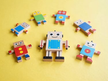 Flat-lay of a colorful wooden STEM robot kit on a bright yellow surface, natural daylight