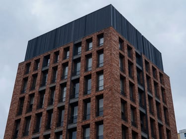 High-end commercial real estate in Bogota, cool overcast daylight, brick and modern steel accents