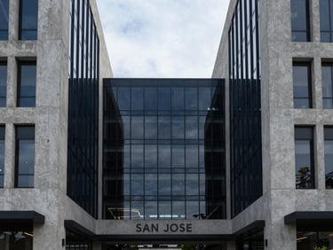 Symmetrical architectural shot of a luxury commercial hub in San Jose, overcast daylight, concrete and glass textures