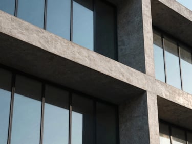Macro shot of modern architectural concrete and glass facade, sharp angles, dark shadows, cool-toned screen glow reflections