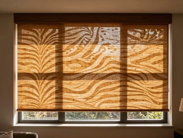 Elegant custom zebra blinds and wooden roller blinds filtering warm golden-hour sunlight in a modern living room
