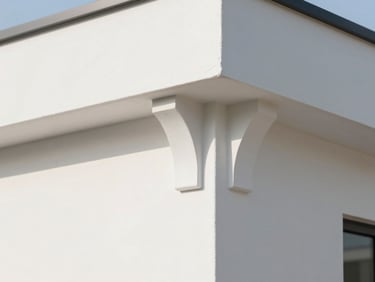 Close-up of a freshly painted wall edge and clean modern fixtures in bright daylight, sharp architectural detail