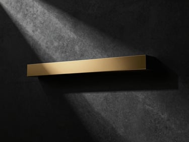 Abstract architectural shadows cast on a dark concrete wall, sharp minimalist lines, premium luxury aesthetic