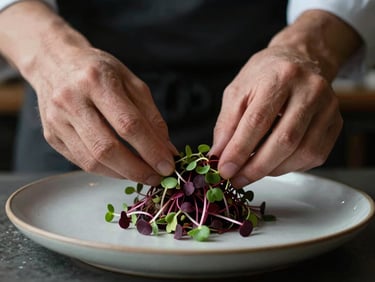 Moody close-up of a chef gently placing microgreens on a modern ceramic plate, soft side-lighting, shallow depth of field, 35mm