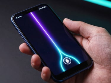 Macro close-up of a hand holding an Android phone displaying a fluid, neon-lit physics game, vibrant purple and cyan light trails on the screen, dark studio background, sharp focus, 35mm