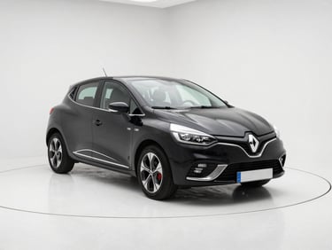 Three-quarter front view of a black Renault Clio on clean white studio floor, daylight from above, chrome door handles reflecting light, minimal background