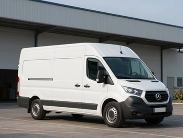 A modern white refrigerated transport van with Kühlkoffer structure parked in front of a clean industrial warehouse in Schleswig-Holstein, cool northern daylight.
