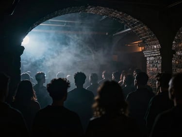 Atmospheric crowd silhouettes in a dark London brick archway club, obscured by heavy smoke and backlit by a single cool blue light, cinematic.