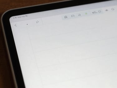 Close-up of a clean Android note-taking screen showing sparse monospaced text on white, single cursor blinking, bright daylight from one side
