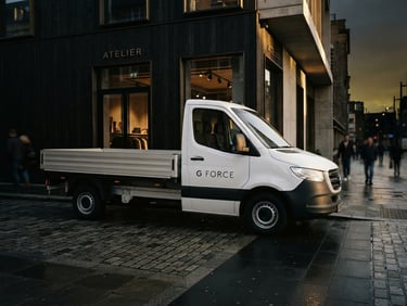 A pristine white drop-side delivery van with minimalist black G Force signage, parked on a clean street outside a modern architectural boutique, dramatic side lighting, 35mm.