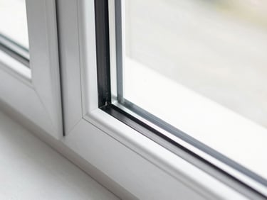Close-up of a sleek, modern UPVC casement window frame in a luxury interior, bright crisp daylight, architectural lens.