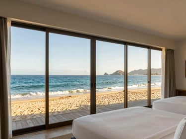 Modern hotel room interior in Mazatlan with floor-to-ceiling windows showing the beach