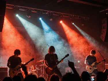 Energetic live concert photography, rock band on stage, raw stage lights cutting through haze, high contrast, gritty