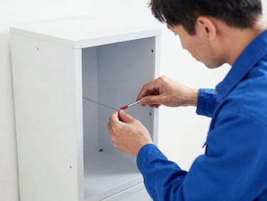Close-up of a technician checking a termite bait station installed in the ground, neat and professional, bright daylight