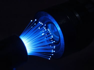 Macro shot of glowing blue fiber optic streams pulsing through a dark metallic conduit, high contrast, low-key light, 35mm