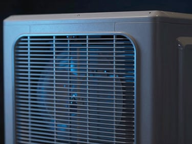 Close-up of clean, precision-engineered metallic fins inside an AC unit, dark moody background, sleek plastics.