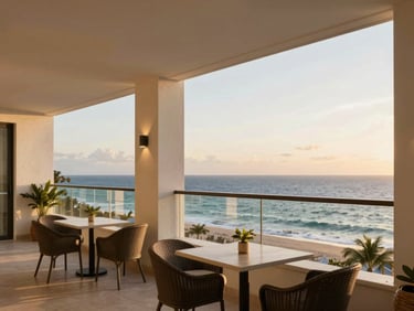 Elegant apartment balcony overlooking the ocean in Puerto Plata, cozy outdoor seating, warm sunset light, high-end editorial feel.