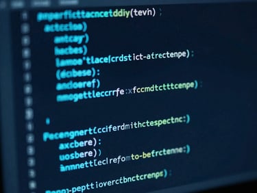 Macro shot of clean, well-structured code on a dark monitor, glowing with electric cyan syntax highlighting, low-key lighting, shallow depth of field