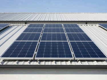 Straight-on architectural shot of a 6kW solar system on a residential building, clean industrial aesthetic, bright sunlight.