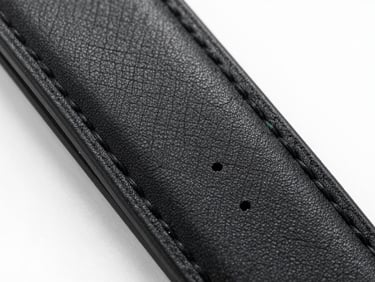 Macro shot of premium black leather strap stitching, showing the precise thread work and high-quality texture.