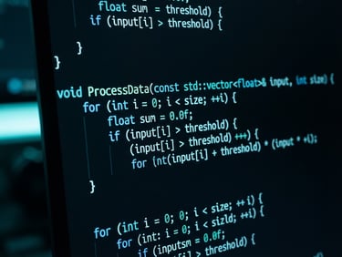 Tight macro shot of structured source code on a high-resolution dark monitor, cool neon-cyan ambient glows, sharp focus, technical blueprint aesthetic, 35mm