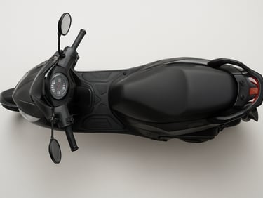 Overhead studio shot of a 125cc commuter scooter, neutral white surface, even daylight, full scooter visible from above showing floorboard and handlebar layout