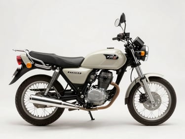 Overhead studio shot of a 110cc commuter motorcycle, neutral white surface, even daylight, full bike visible from above showing seat and fuel tank profile