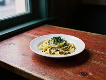 A rustic wooden table in a dimly lit Copenhagen bistro, a plate of fresh pasta with herbs, soft natural window light, 35mm film style