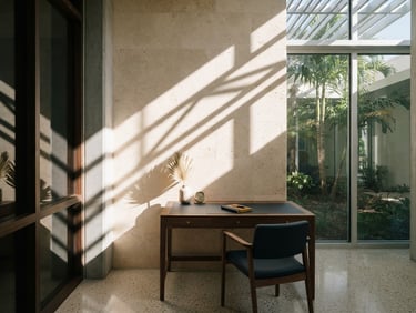 Architectural detail of a quiet, modern Sarasota private office, crisp geometric shadows on limestone, bright natural Florida daylight, 35mm lens