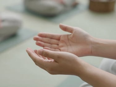 Close-up of hands during a quiet Reiki practice, soft natural daylight, muted sage tones, shallow depth of field, 35mm