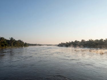 Wide panoramic shot of the Savannah River in Augusta at quiet morning daylight, soft mist rising, clear horizon, 35mm photography