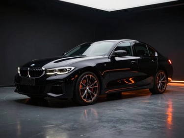 Low angle cinematic shot of a sleek black BMW 320i sedan in a dark studio, sharp orange neon reflections tracing the body lines, high contrast, 35mm