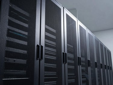 Geometric angle shot looking down a long aisle of modular data center cabinets, controlled cool studio lighting with crisp shadows on cabinet edges, deep perspective emphasizing system order and scale, no people, no decorative elements