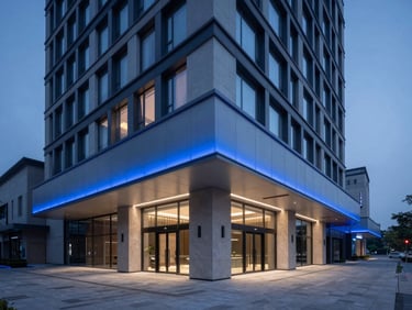 Modern minimalist luxury hotel lobby at dusk with cool blue LED lighting accents, clean lines, professional corporate atmosphere