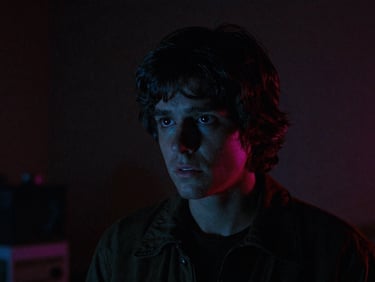 Dark, moody still from a 80s cult horror film, neon lighting, dramatic shadows, analog film grain, cinematic film photography, low-key neon lighting, retro synthwave color palette, heavy analog film grain, 35mm lens