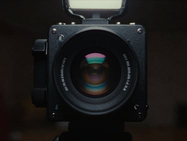 High-contrast still from a 90s action movie, gritty aesthetic, dramatic backlighting, analog film grain, cinematic film photography, low-key neon lighting, retro synthwave color palette, heavy analog film grain, 35mm lens