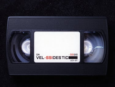 VHS cover art for a 90s B-movie horror film, dark and gritty, neon accents, heavy film grain