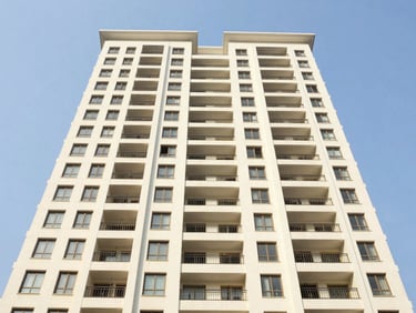 Bright architectural exterior of an AdityaRaj residential tower in Vikhroli East, clean modern facade, blue sky, natural daylight